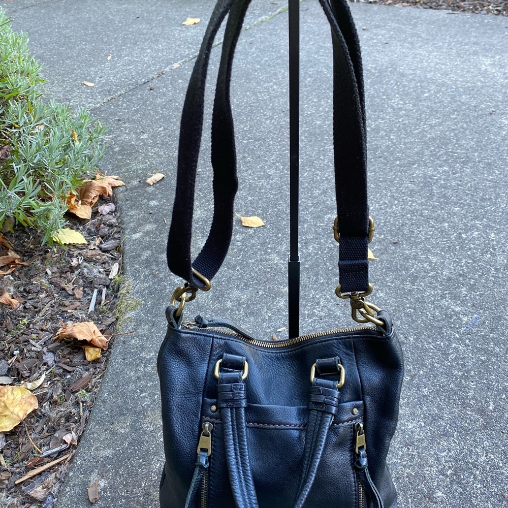 The Sak Black Leather Shoulder Bag with Brass Accents